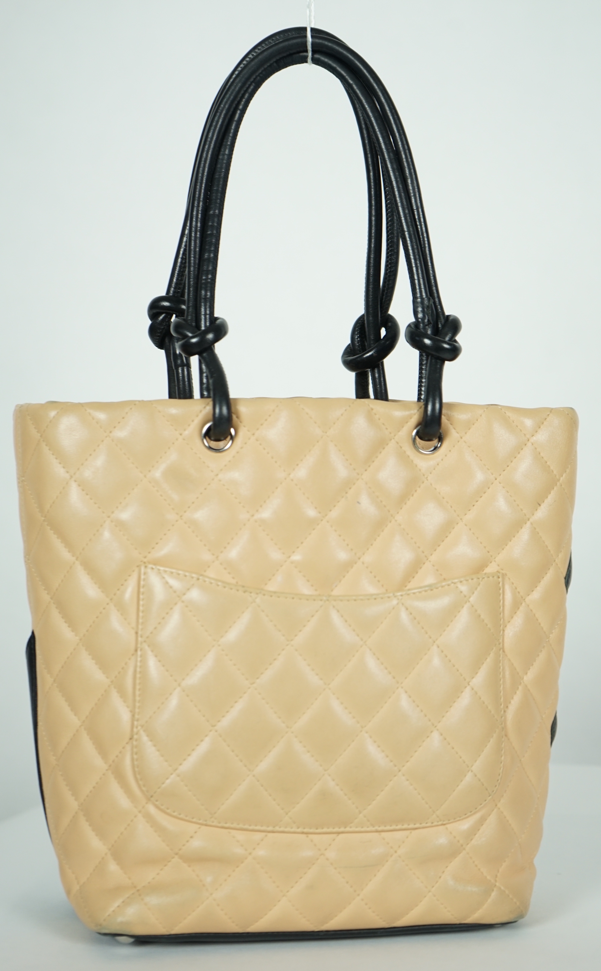 A Chanel Cambon Ligne black and beige quilted leather tote, width 26cm, height 24cm, overall height 40cm, depth 11cm, Please note this lot attracts an additional import tax of 20% on the hammer price